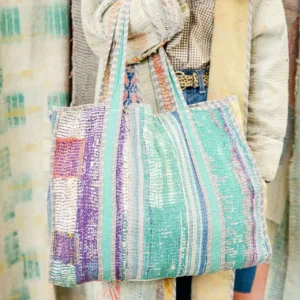 Colorful woven tote bag with striped pattern.
