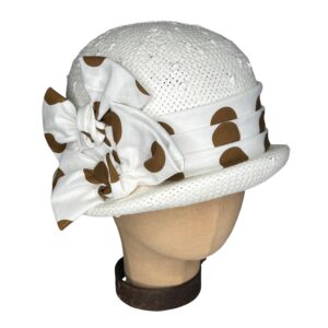 White hat with polka dot ribbon bow.