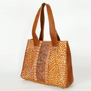 Brown leather handbag with decorative patterns.