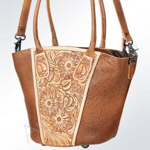 Brown leather handbag with floral design.