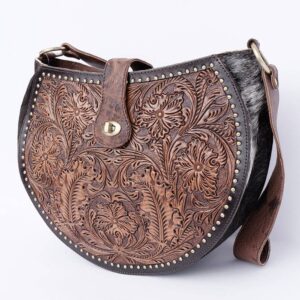 Ornate leather handbag with floral engraving.